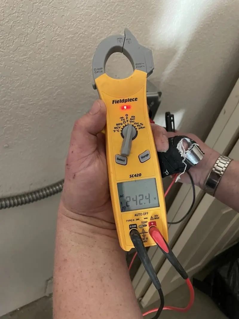 Voltage testing with clamp meter during Generator Installation in Berwyn